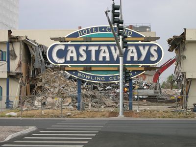The damaged Castaways sign standing before the partially demolished bowling-center facade in 2006